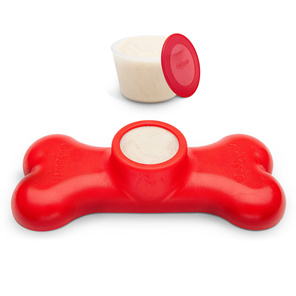 a red dog toy with a white bowl