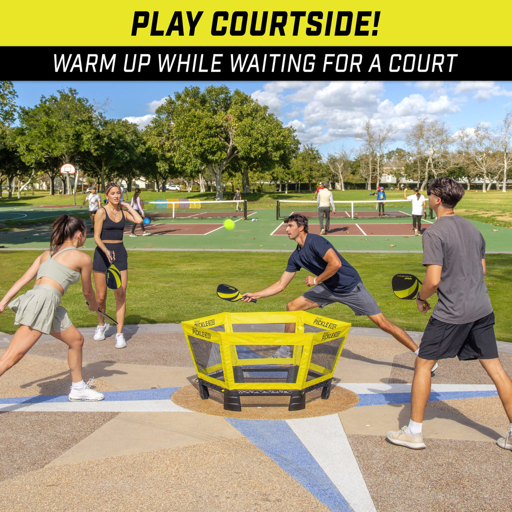 a group of people playing with a yellow cart