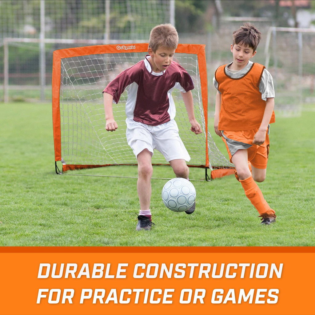 two boys playing soccer on a field with the words drib construction for practice games