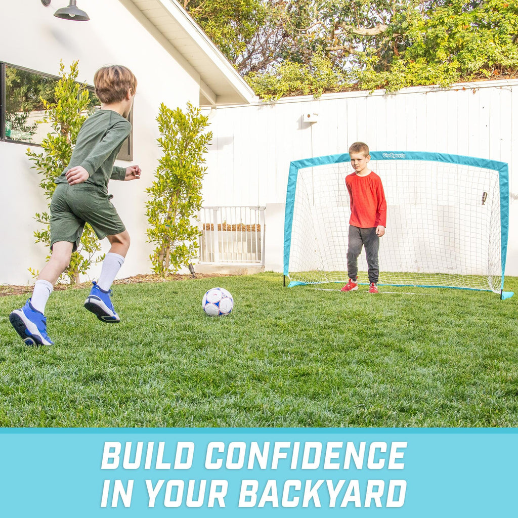 a boy kicking a soccer ball in the yard with the text, build your backyard soccer game