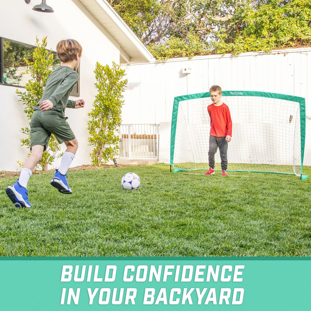 a boy kicking a soccer ball in the yard with the text, build your backyard soccer game